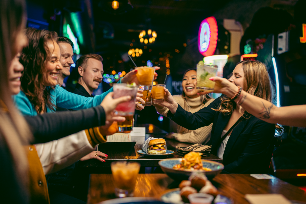 Guests enjoying food, drinks and games at Greta Bar