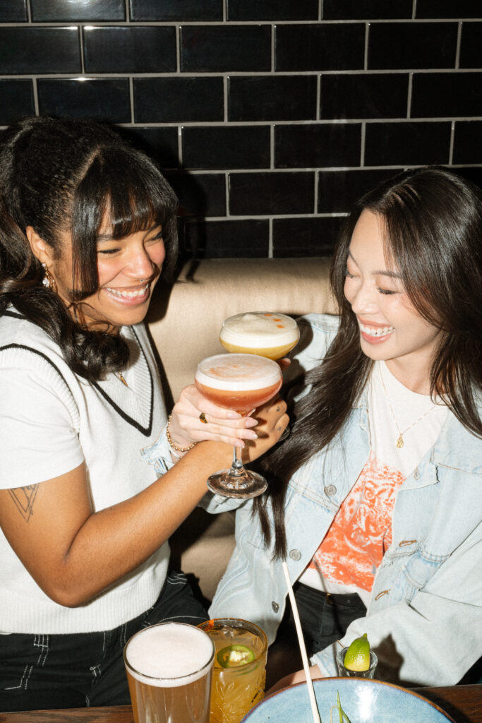 Guests enjoying food, drinks and games at Greta Bar