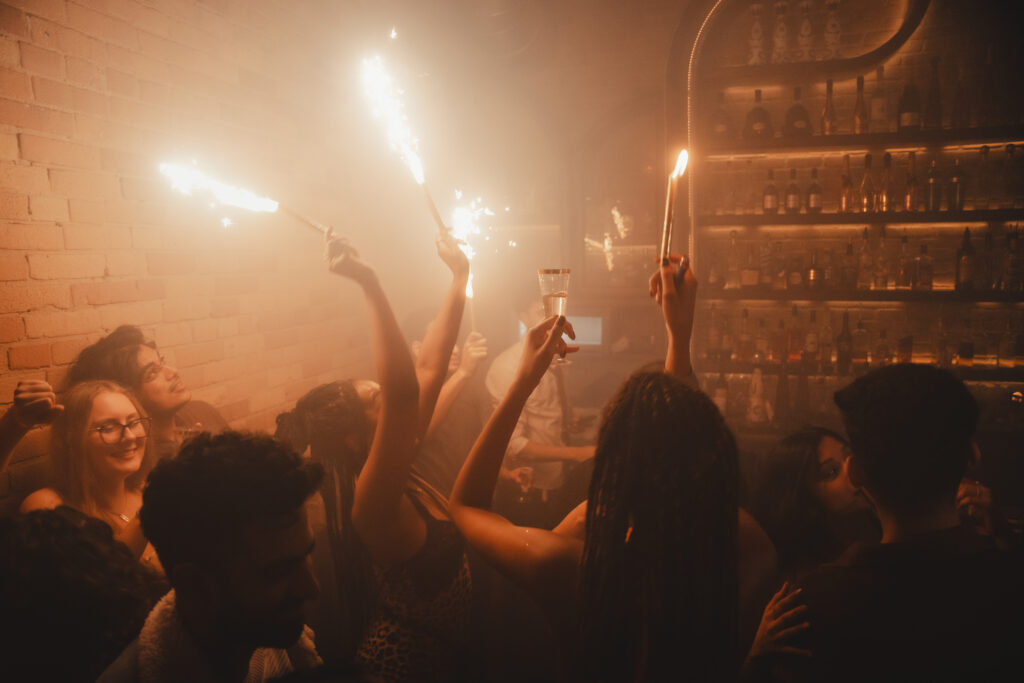 People dancing and enjoying music during late-night events at Greta Bar