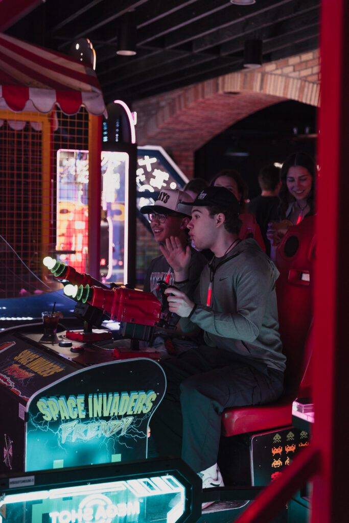Guests enjoying food, drinks and games at Greta Bar