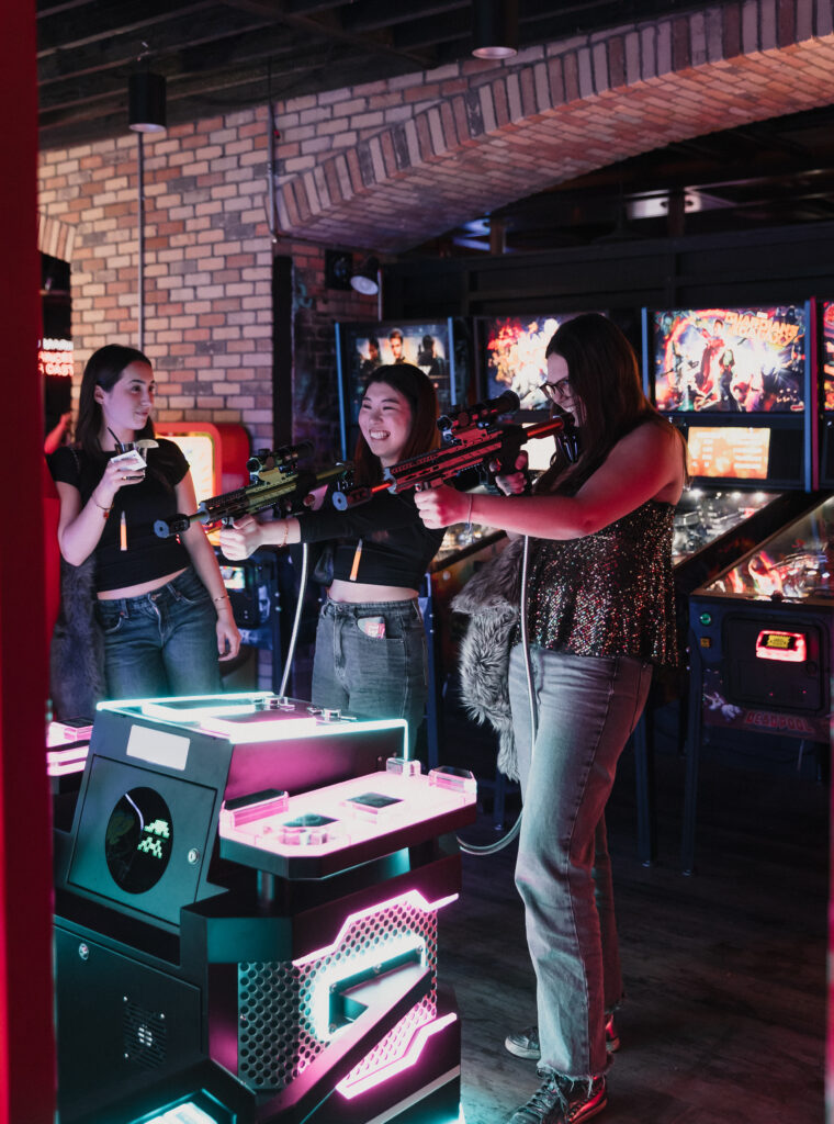 Guests enjoying food, drinks and games at Greta Bar