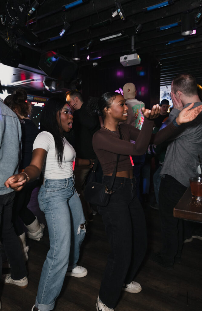 Guests enjoying food, drinks and games at Greta Bar