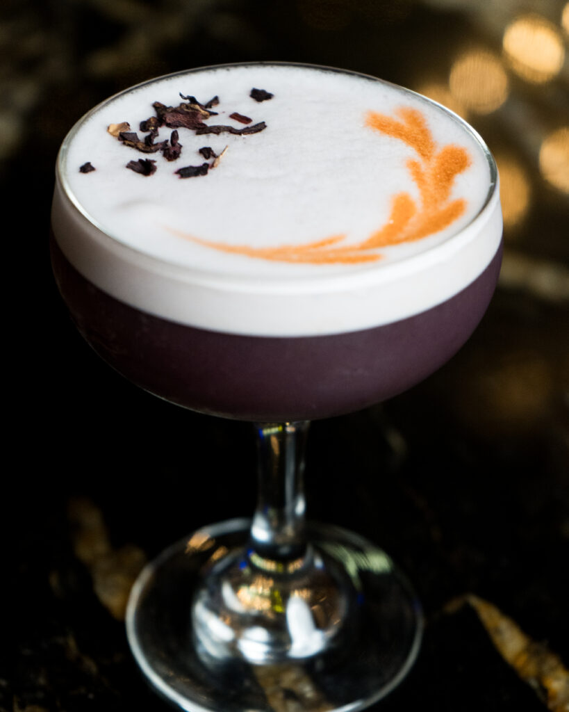 Drinks and cocktails at Greta Bar, showcasing the bar atmosphere, beverages, and alcohol range