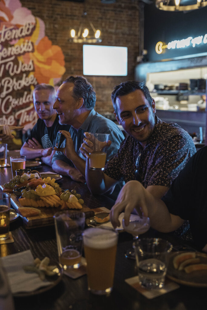 Guests enjoying food, drinks and games at Greta Bar