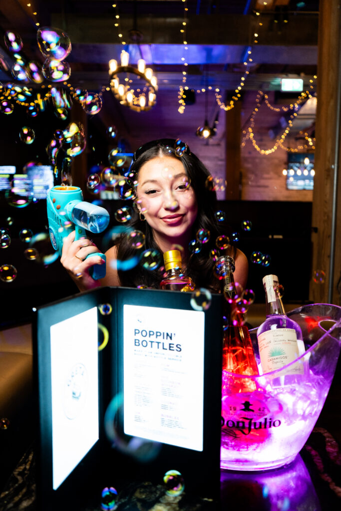 Guests enjoying food, drinks and games at Greta Bar