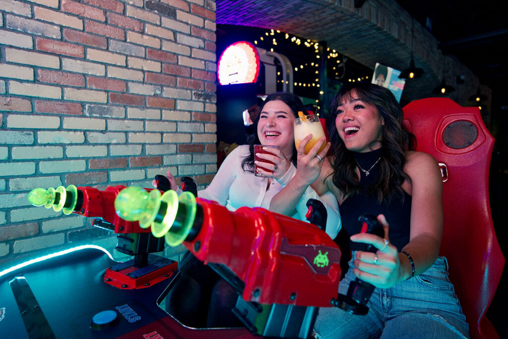 Guests enjoying food, drinks and games at Greta Bar