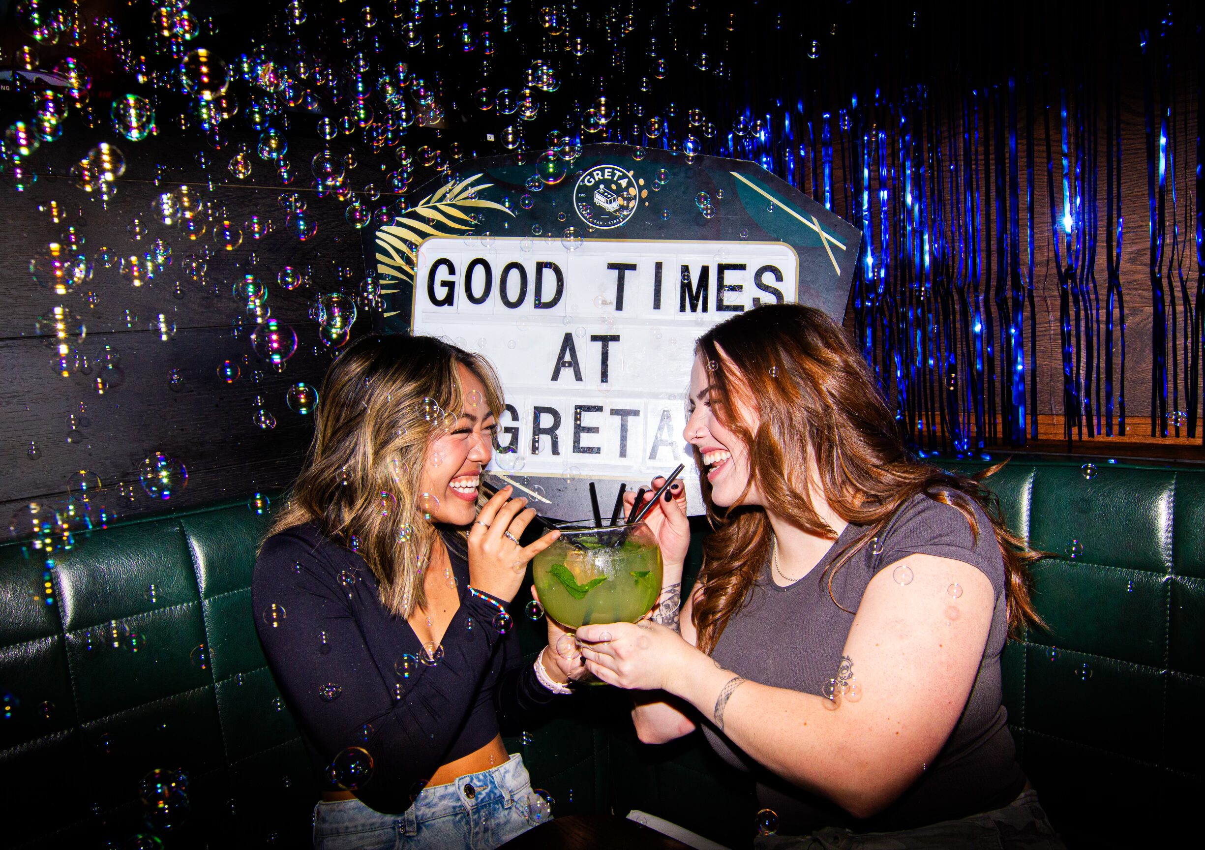 Guests enjoying food, drinks and games at Greta Bar