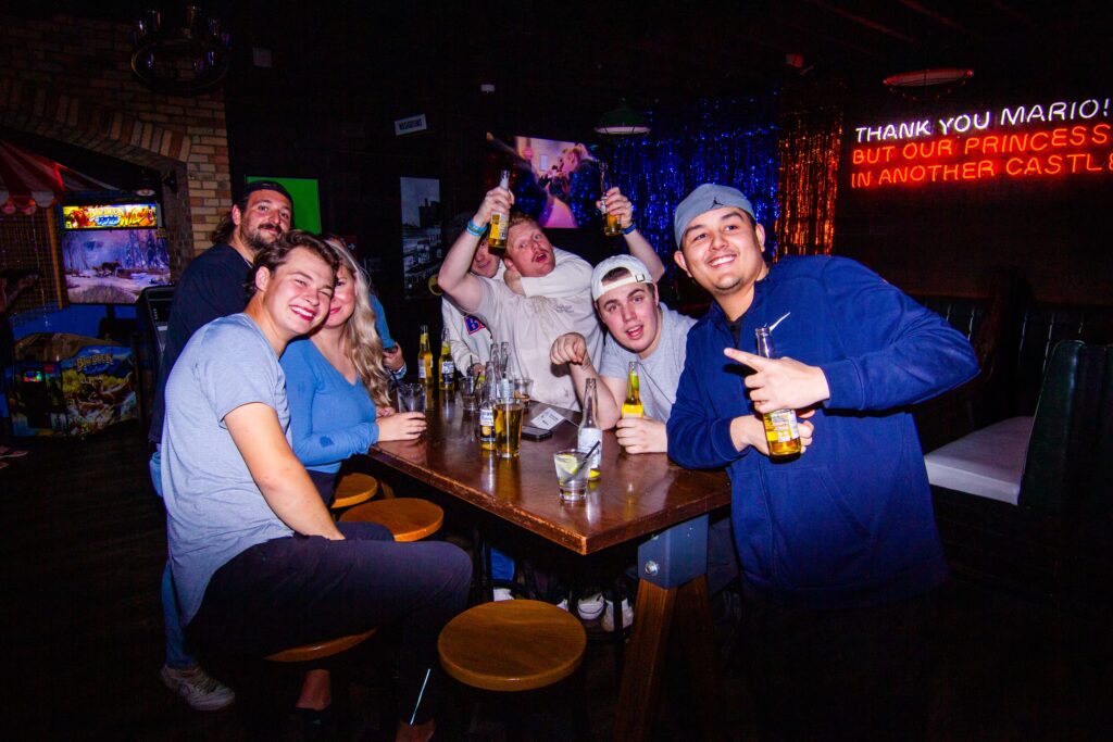 Guests enjoying food, drinks and games at Greta Bar
