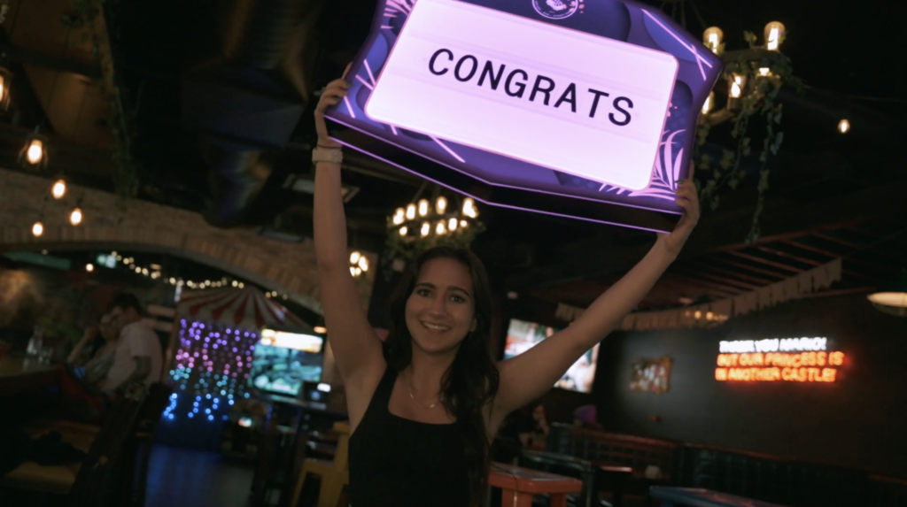 Guests enjoying food, drinks and games at Greta Bar