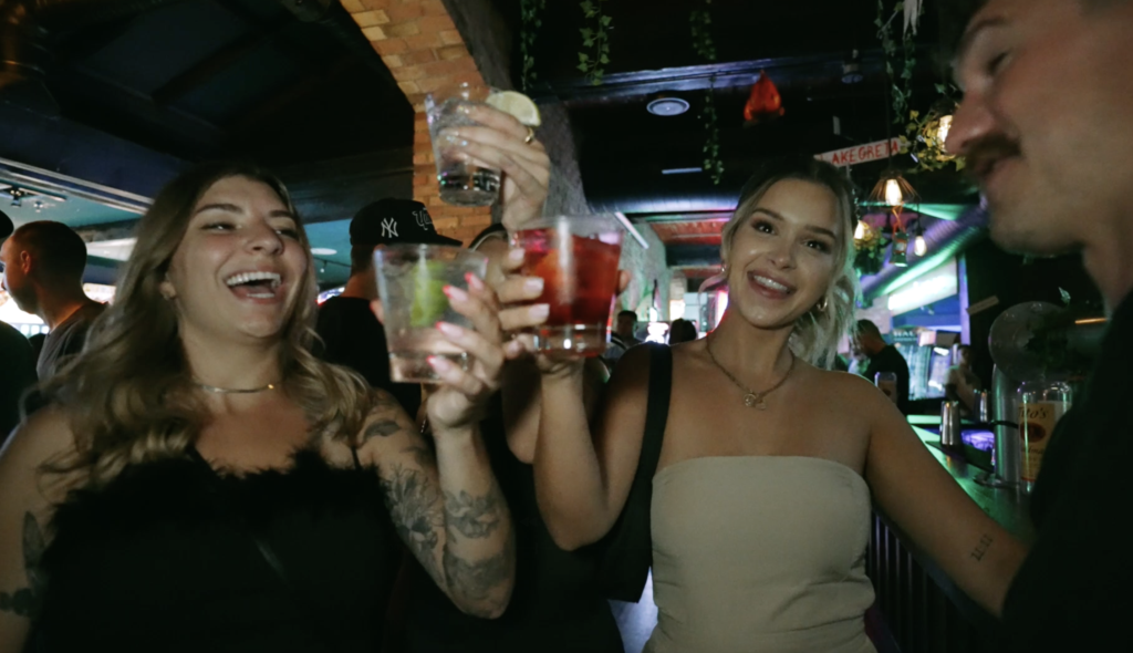 Guests enjoying food, drinks and games at Greta Bar