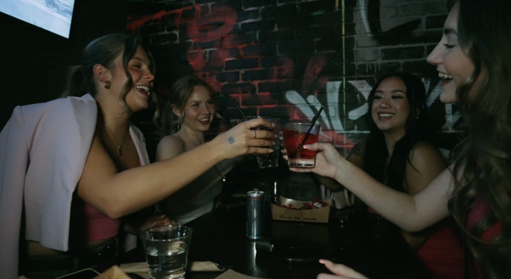 Guests enjoying food, drinks and games at Greta Bar